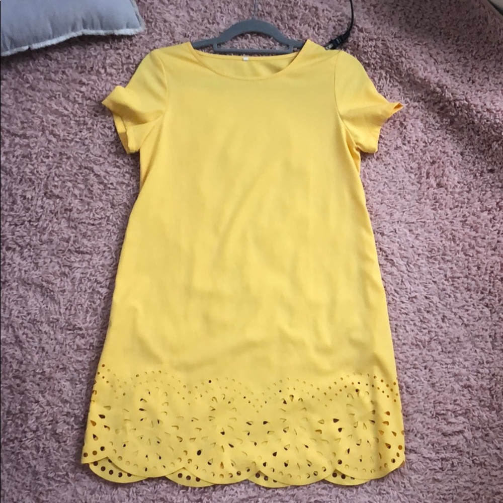 Super cute yellow dress with floral cut outs!